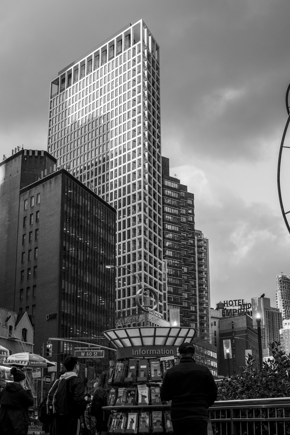 a black and white photo of a city with tall buildings