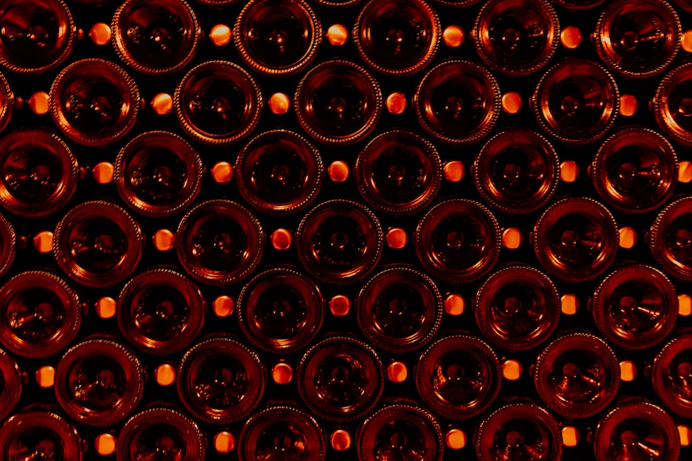 a bunch of wine bottles that are stacked together