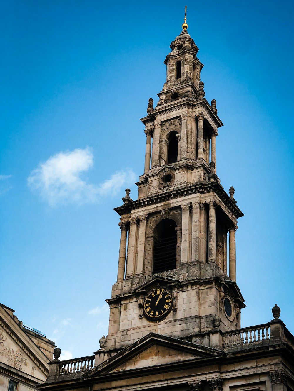 a tall tower with a clock on the top of it