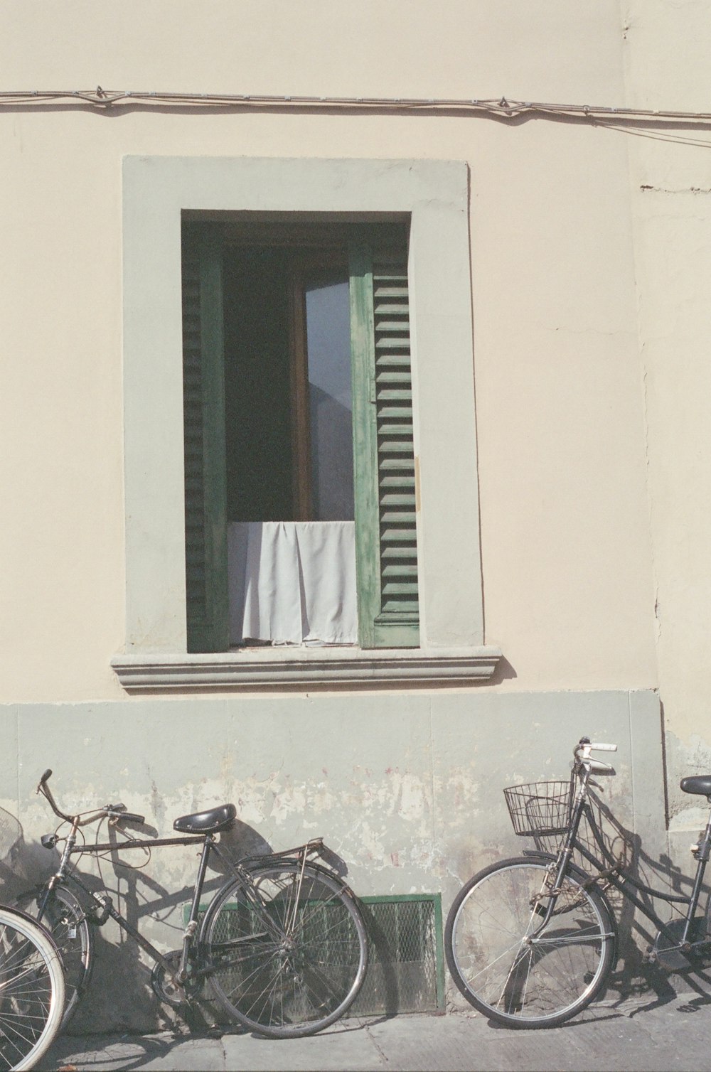 a group of bikes parked next to a building