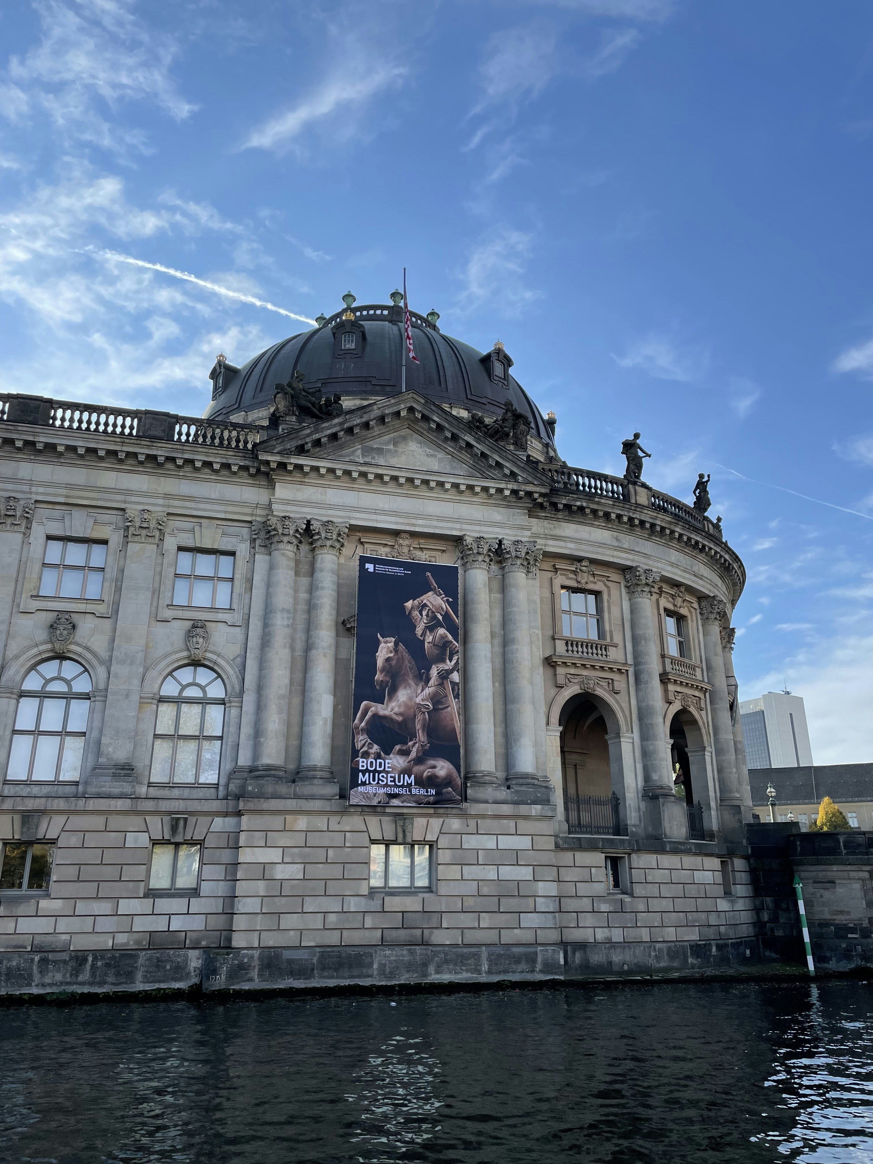 A large building with a giant poster on the side of it photo – Free ...
