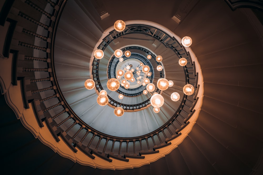 an overhead view of a spiral staircase with lights