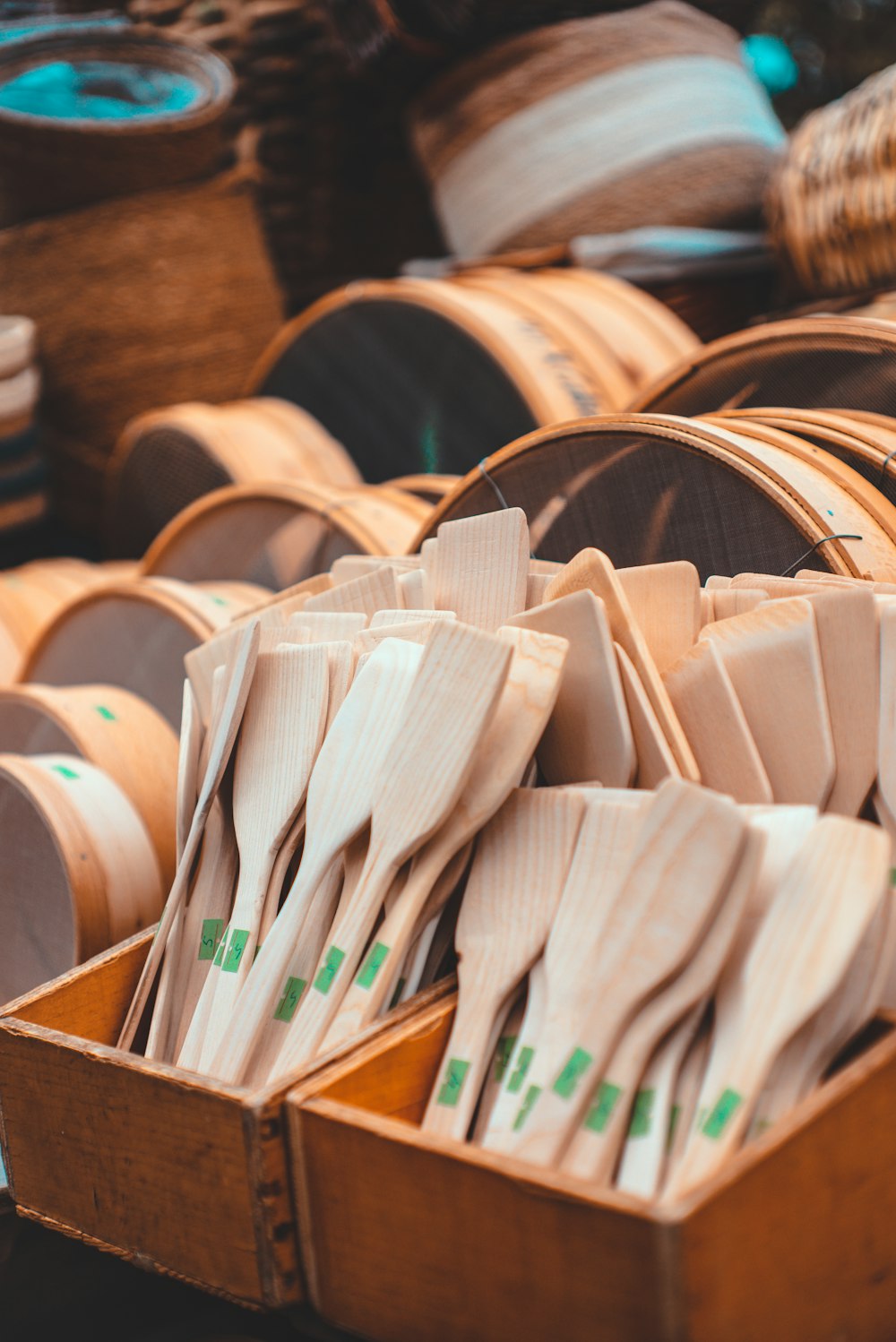 a wooden box filled with lots of wooden utensils