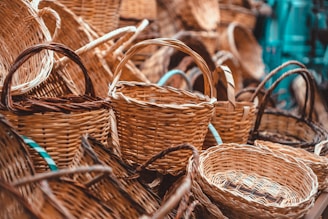 a pile of wicker baskets sitting next to each other