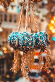 a close up of a bunch of bells hanging from a ceiling
