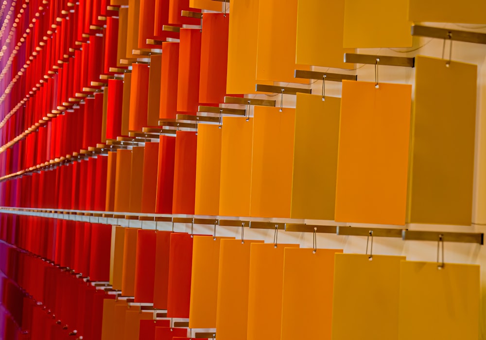a row of orange and yellow colored blinds