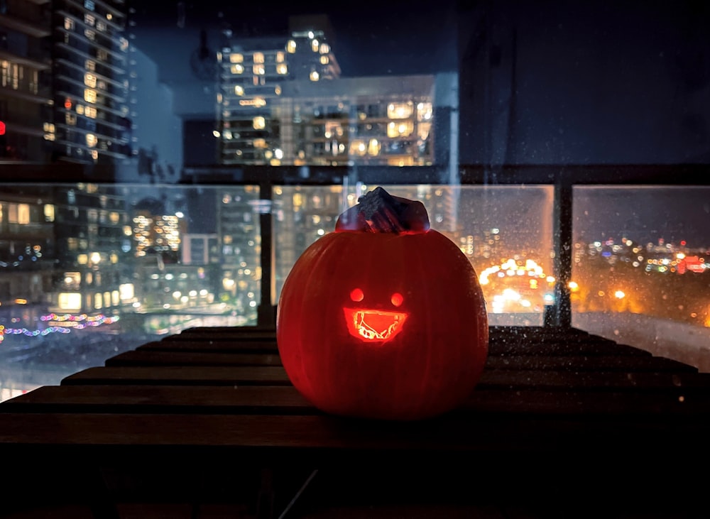 a pumpkin sitting on top of a wooden table