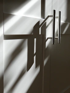 the shadow of a door on a wall