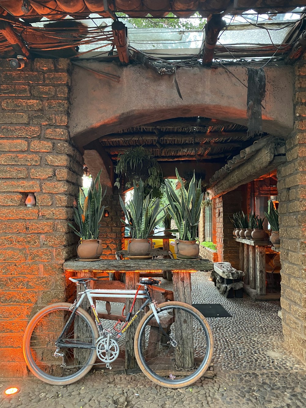 a bicycle is parked in front of a brick building