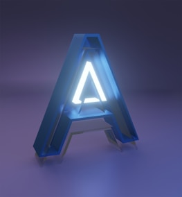 A large, three-dimensional letter 'A' with a glowing interior set against a dimly lit blue and purple background. The letter has a modern and sleek design, with an illuminated white core surrounded by a blue translucent exterior.