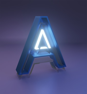 A large, three-dimensional letter 'A' with a glowing interior set against a dimly lit blue and purple background. The letter has a modern and sleek design, with an illuminated white core surrounded by a blue translucent exterior.