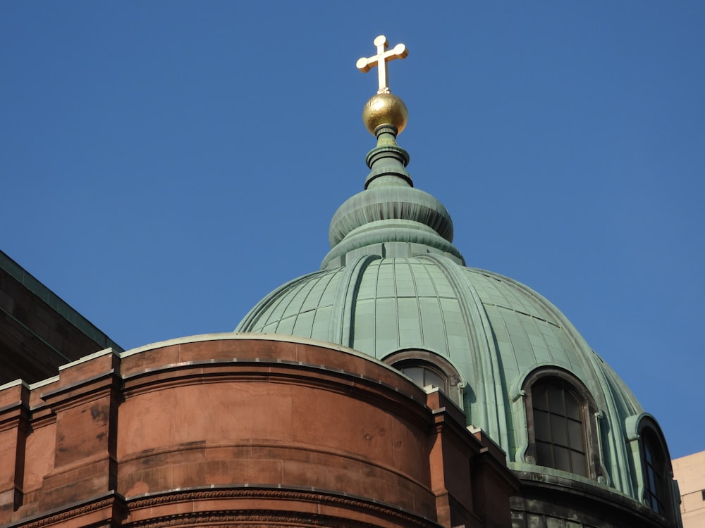 a large dome with a cross on top of it