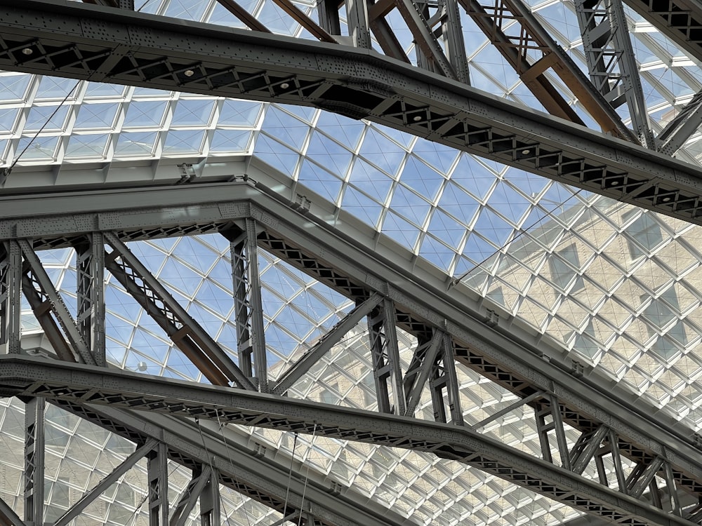 a close up of a metal structure with a sky background