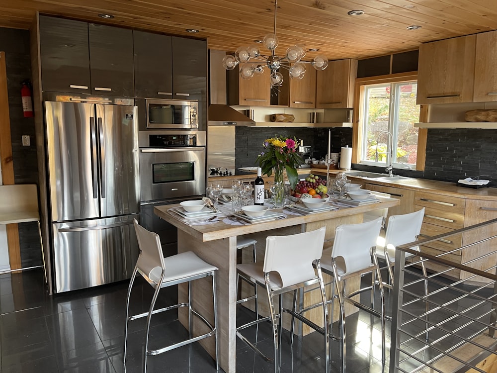 a kitchen with stainless steel appliances and a center island