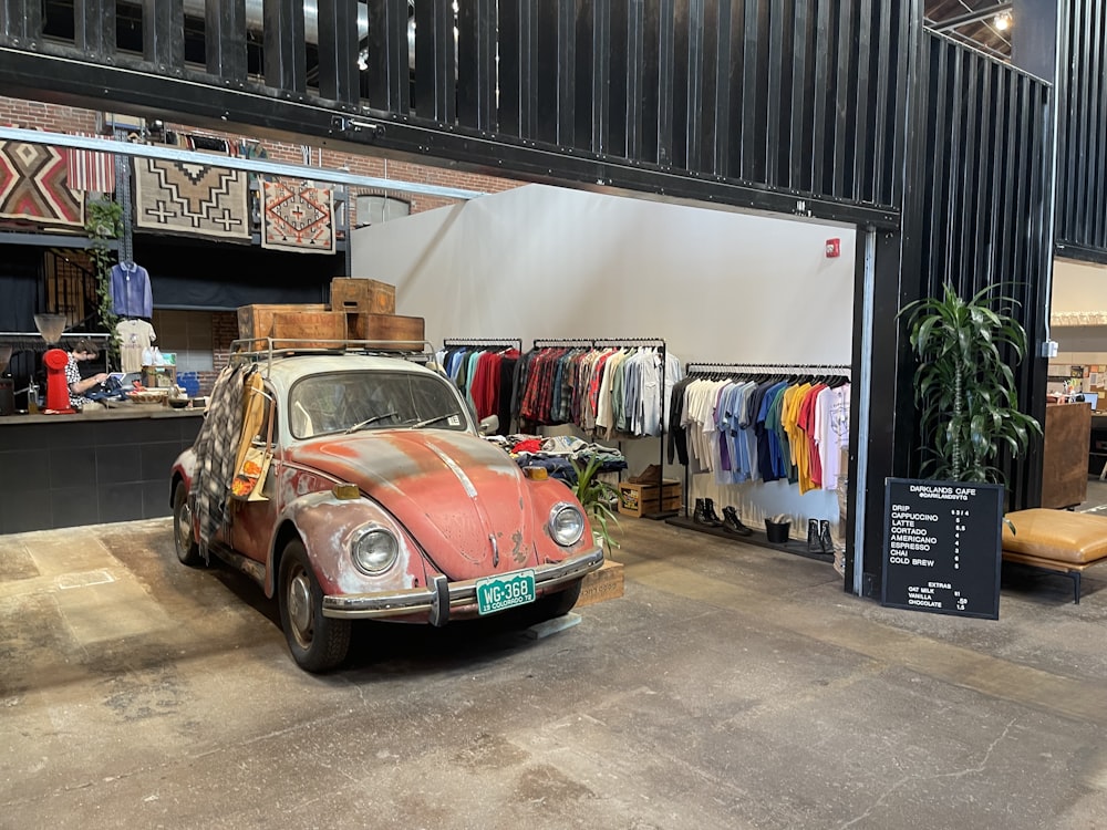 an old car is parked in a garage