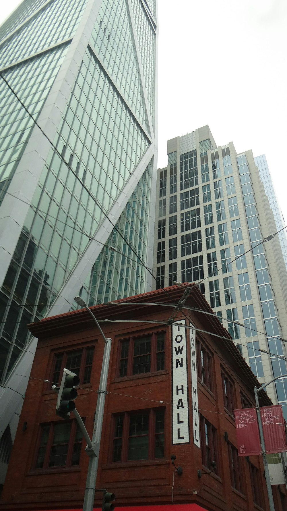a tall red building with a white sign on it's side