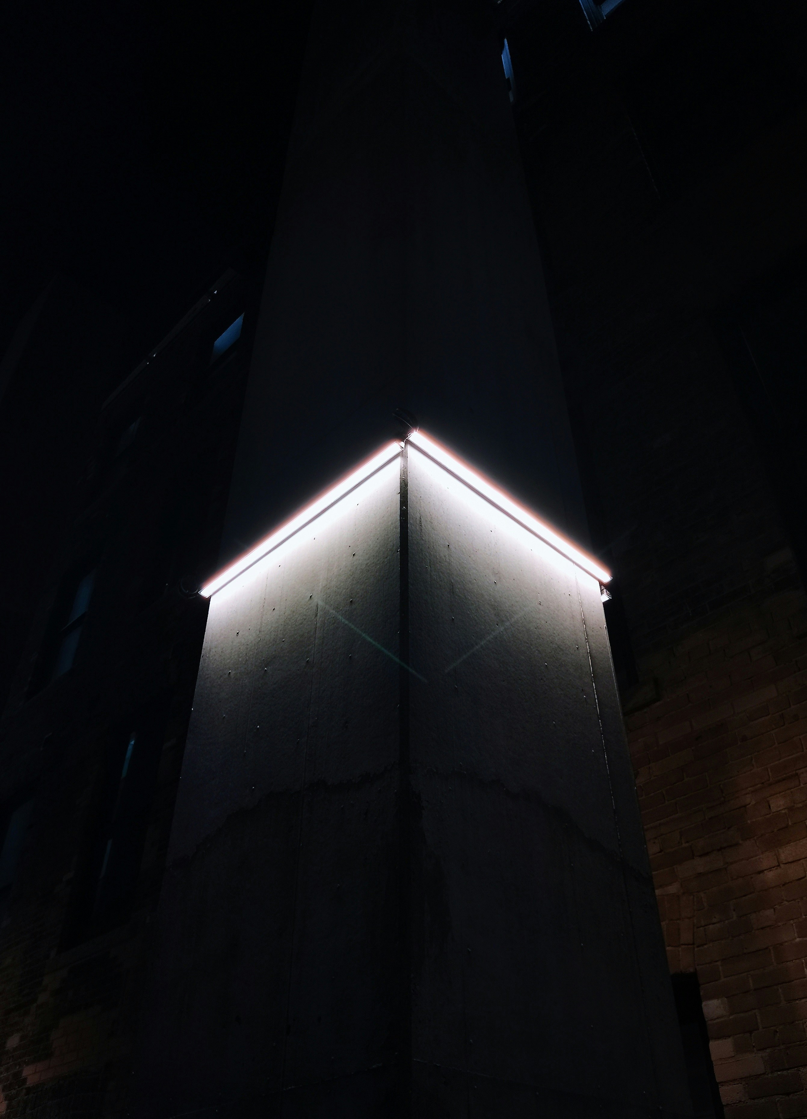 a very tall building with some lights on it