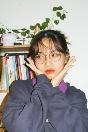 Portrait of Hélène Godefroid in a cozy office surrounded by books and plants.