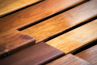 Close-up of oak wood finish PVC flooring plank showcasing natural grain and texture.