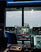 a computer monitor sitting on top of a desk
