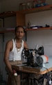 a man standing in front of a sewing machine