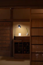 Cozy indoor scene featuring a stylish dresser set with a neatly arranged jewelry organizer on top.