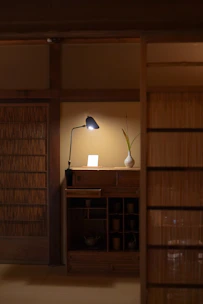 A cozy dresser set in a softly lit bedroom, showcasing smooth wood grain and elegant drawer handles.