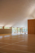 a large empty room with a lot of windows