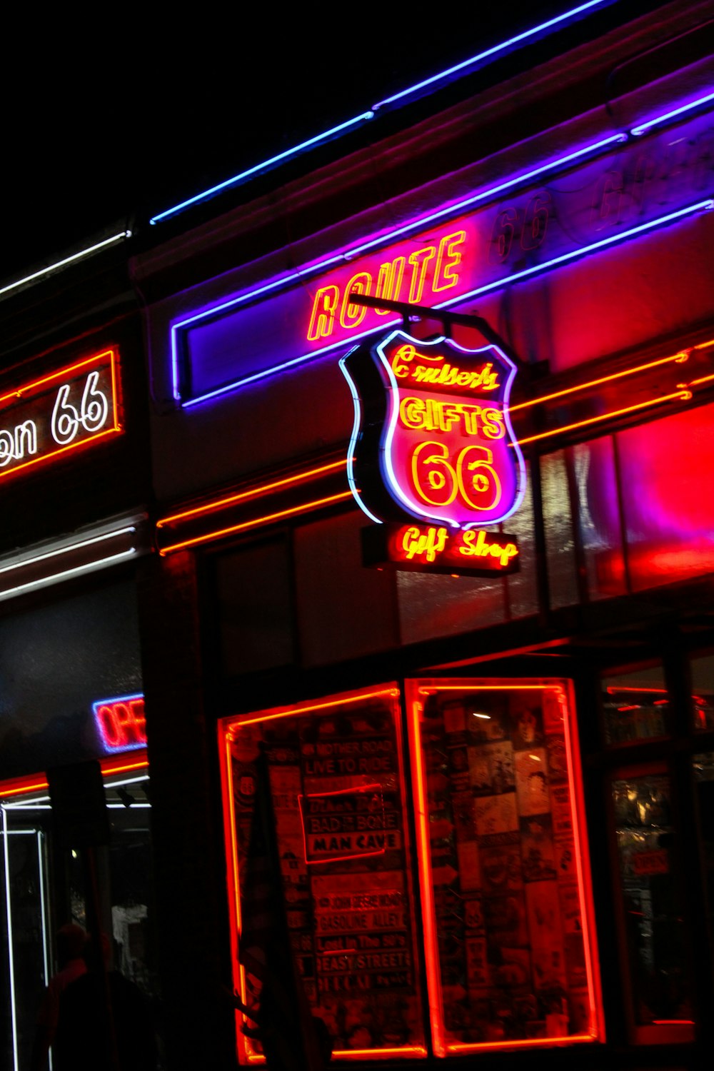 a building with a neon sign on the front of it