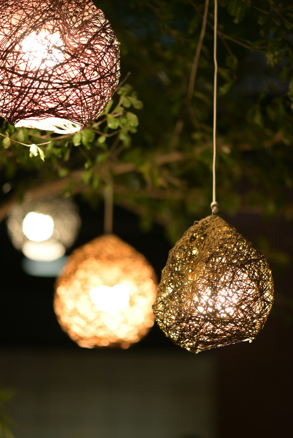 a group of lights hanging from a tree