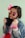 a little girl wearing pink sunglasses and a jean jacket
