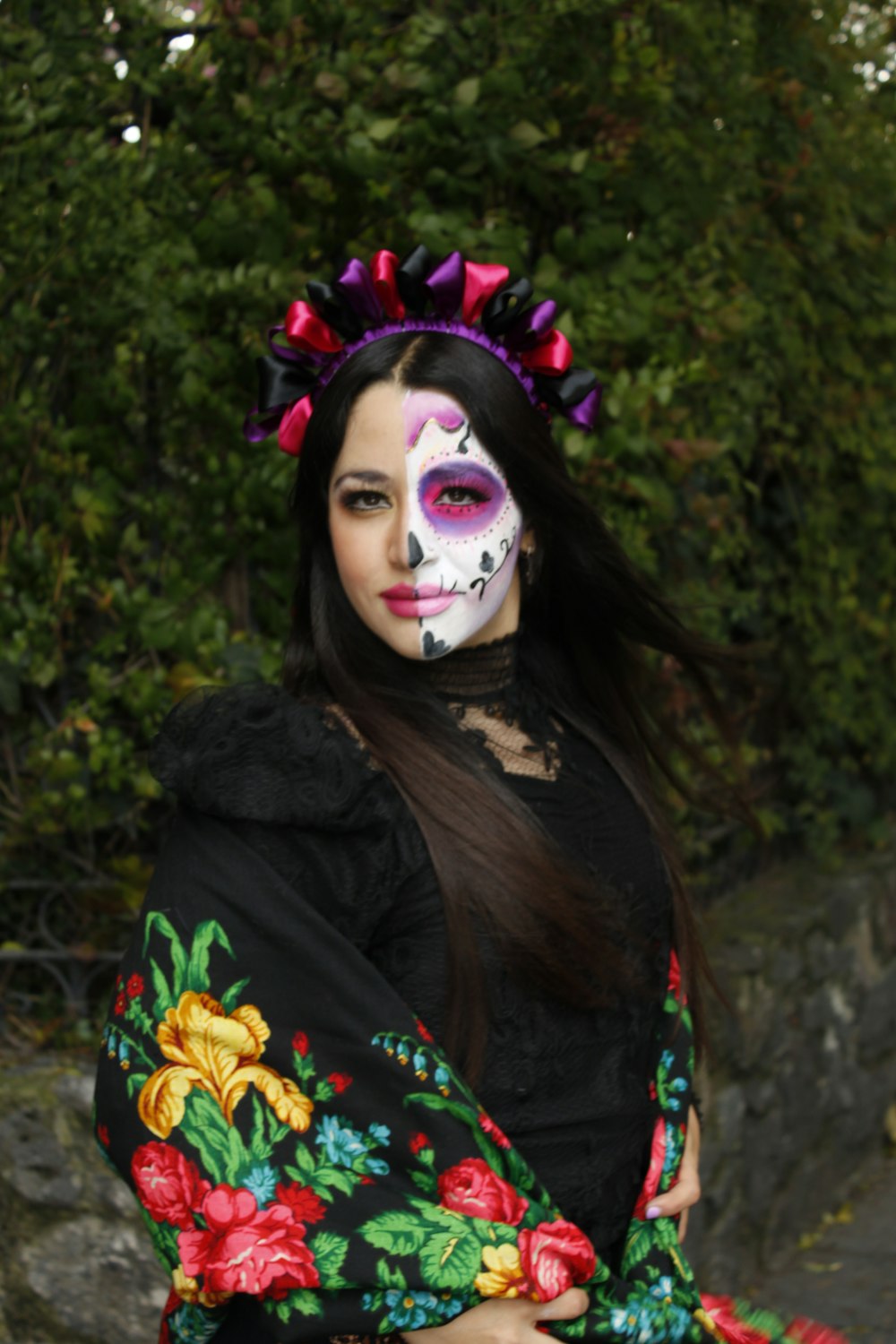 a woman in a mexican day of the dead costume