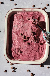 a bowl of ice cream with a spoon in it