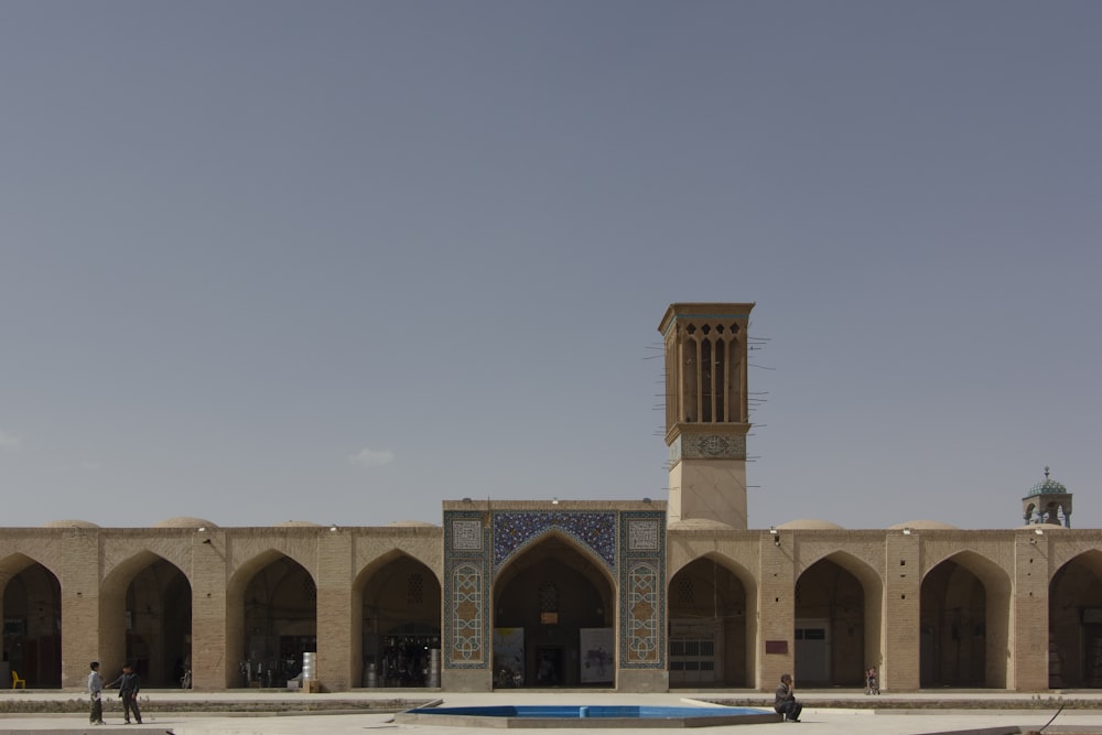 a large building with a clock tower in the middle of it