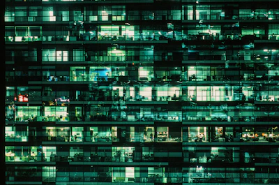 a very tall building with lots of windows at night