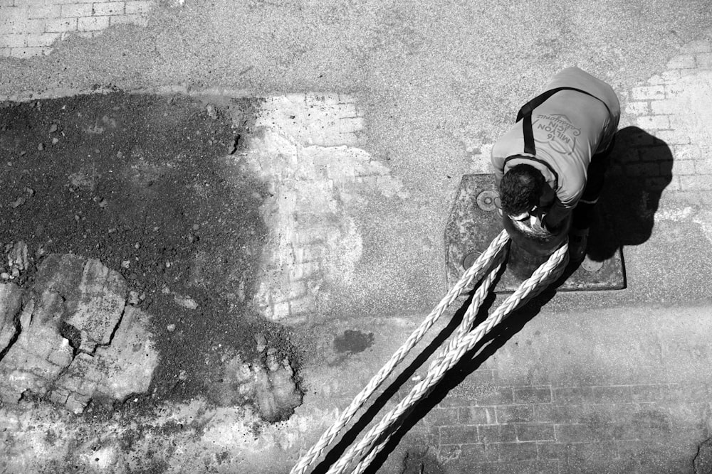 a black and white photo of a person on a snowboard