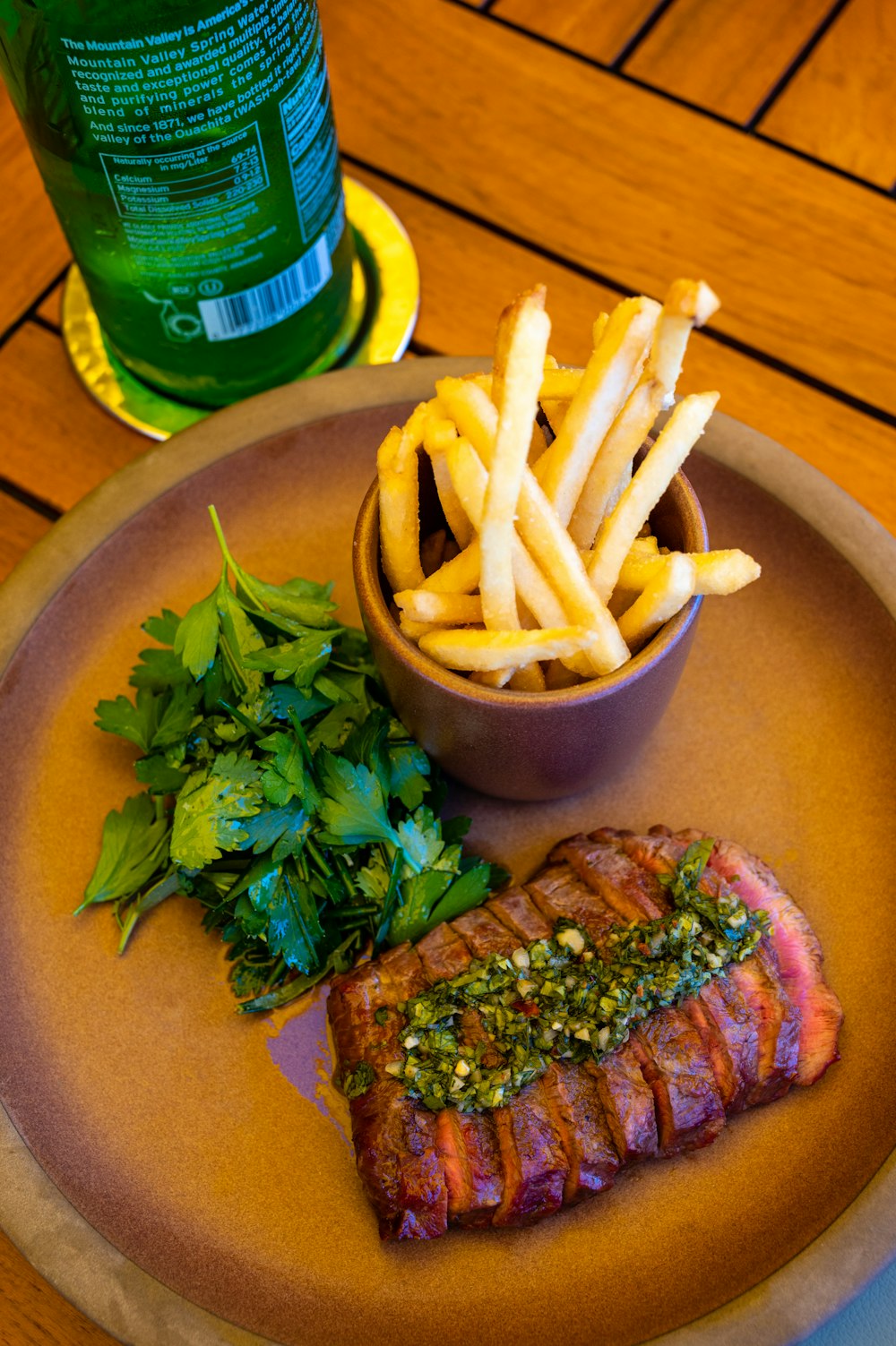 a plate of food on a wooden table