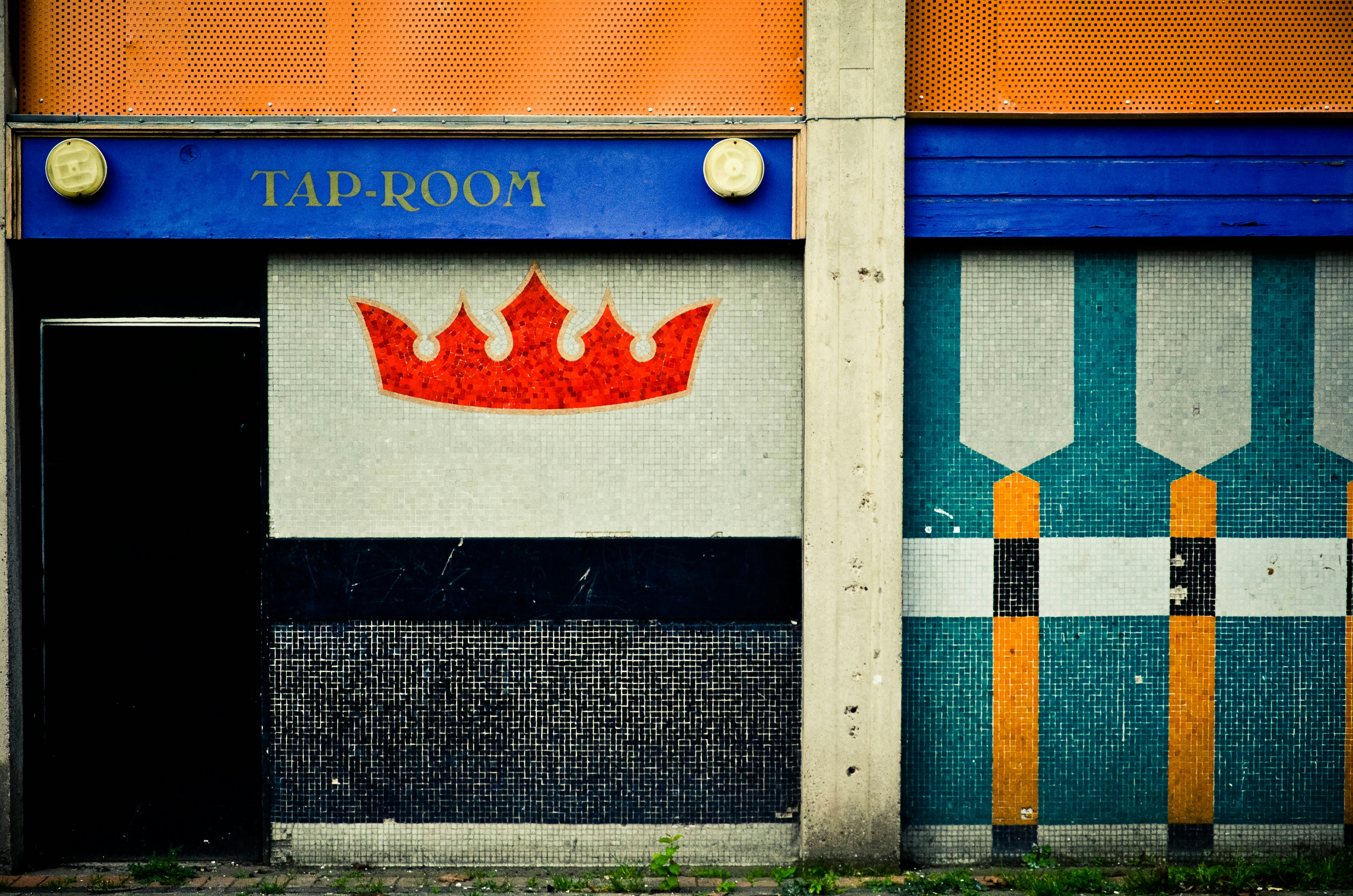 a building with a crown painted on the side of it