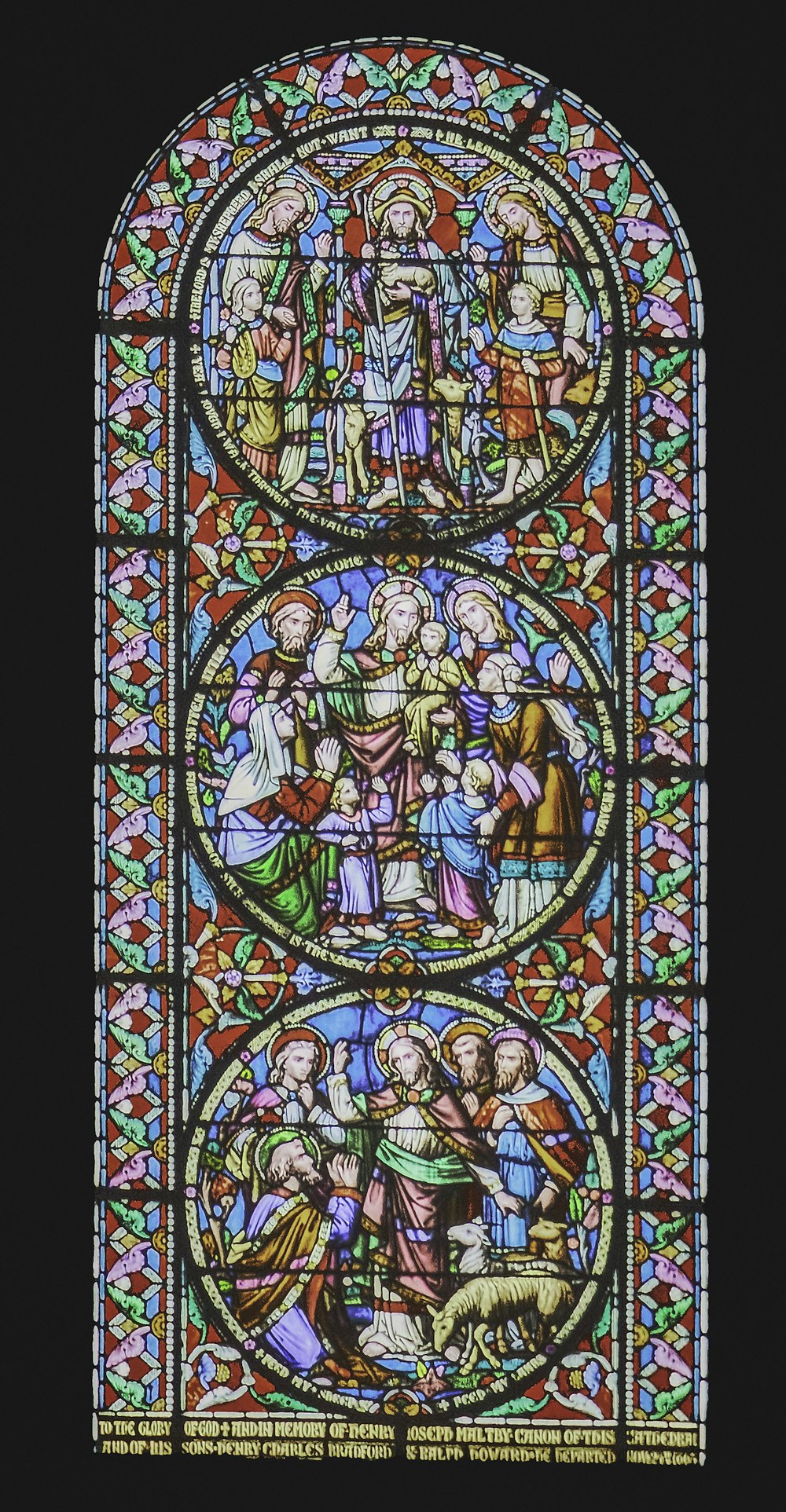 a very large stained glass window in a building