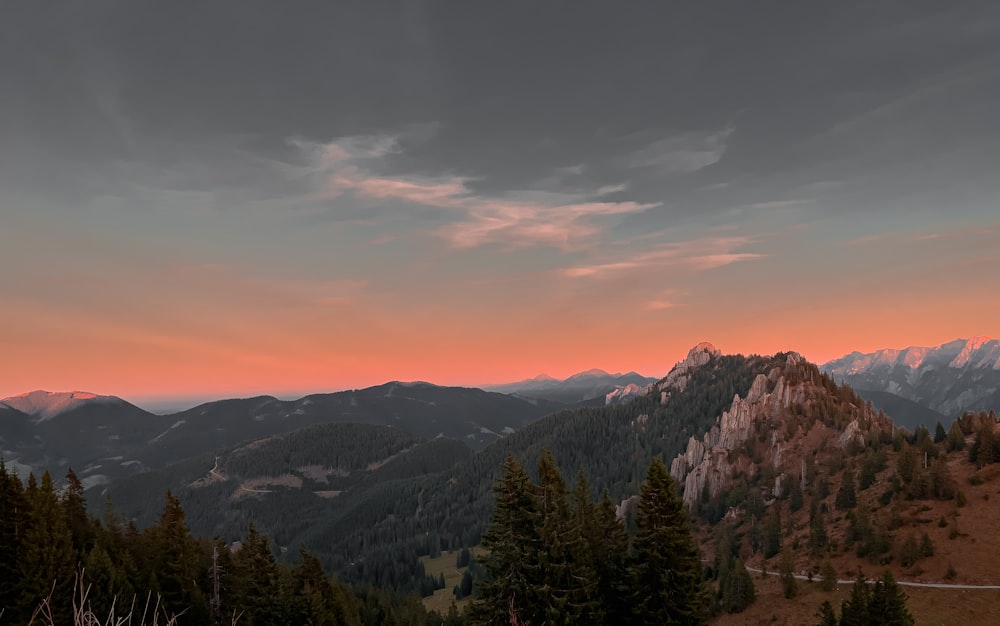 a view of a mountain range at sunset