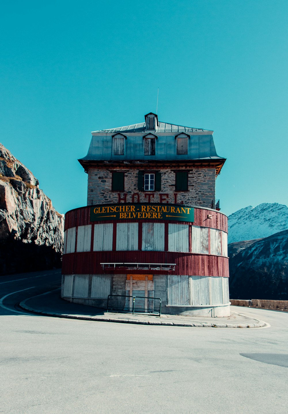 a round building sitting on the side of a road