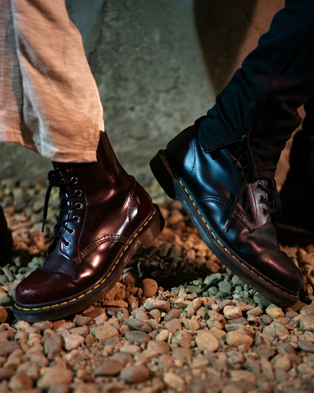 a close up of a pair of shoes on a rocky ground