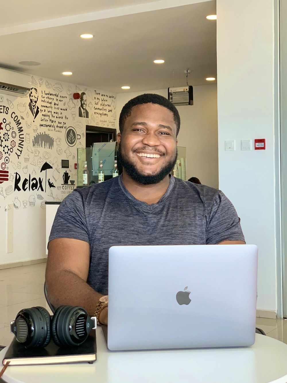 a man sitting in front of a laptop computer