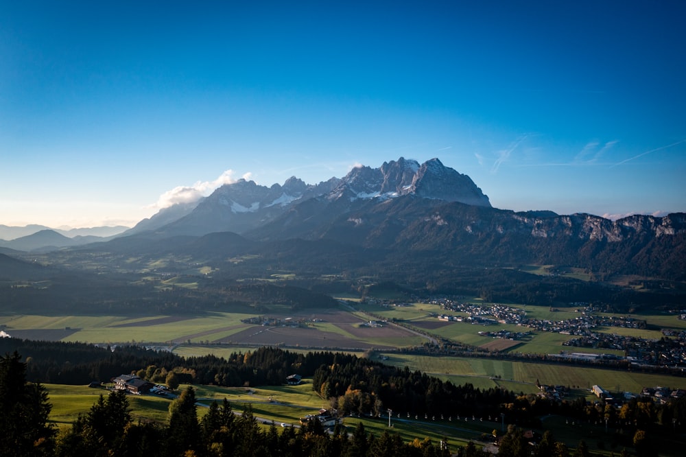 a scenic view of a valley and mountains