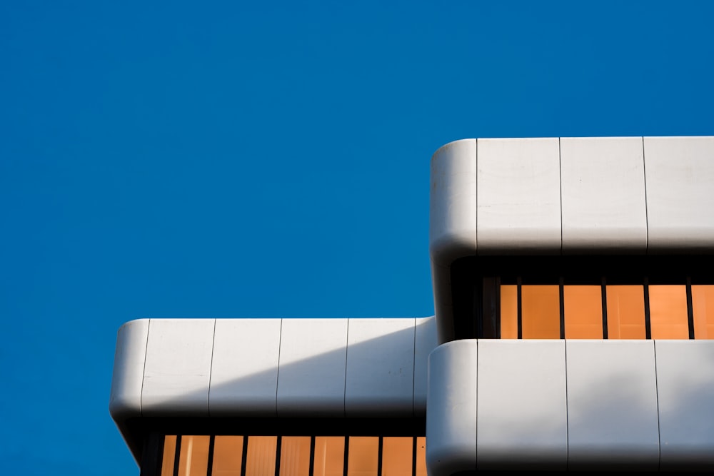 a close up of a building with a blue sky in the background