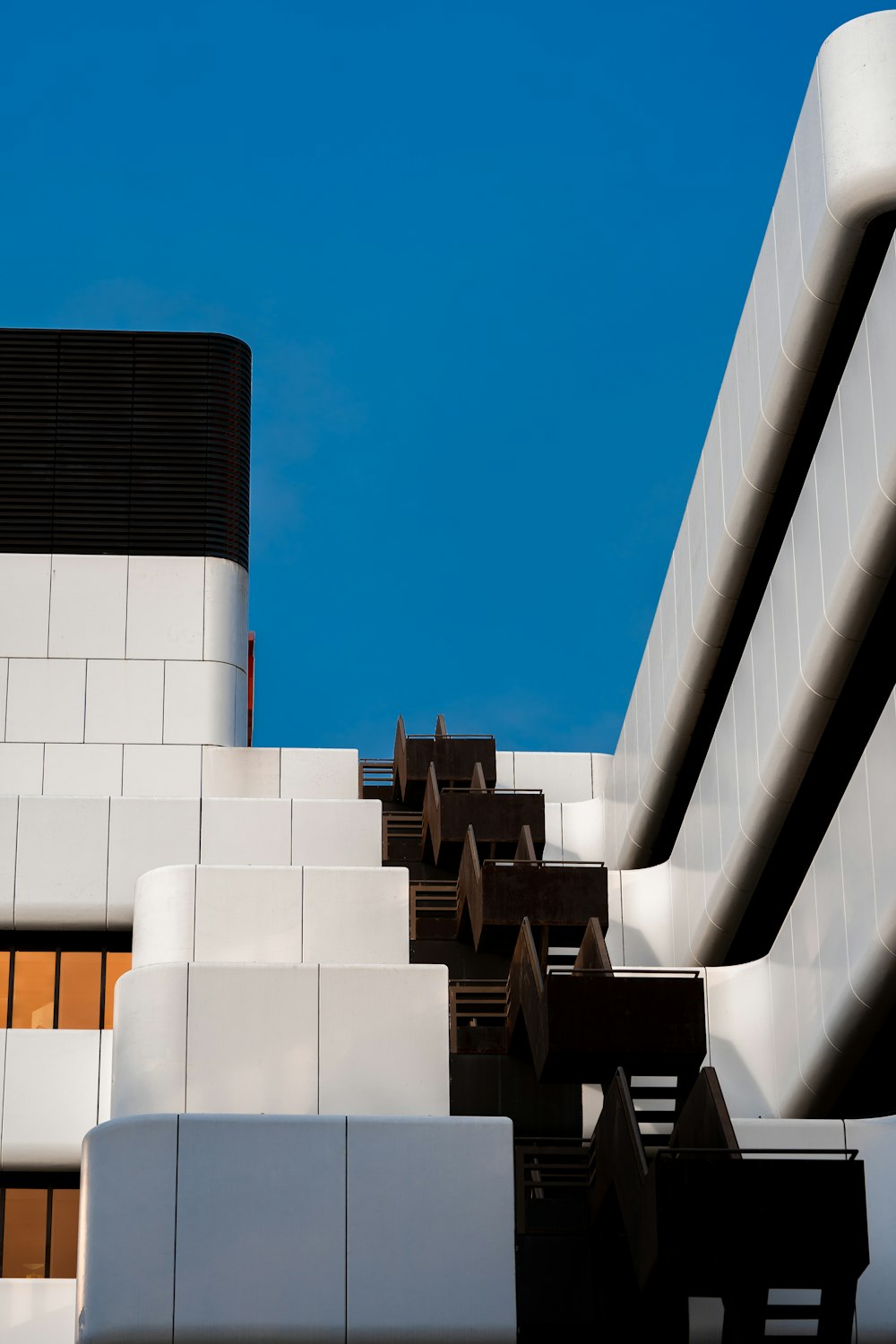 a white building with a blue sky in the background