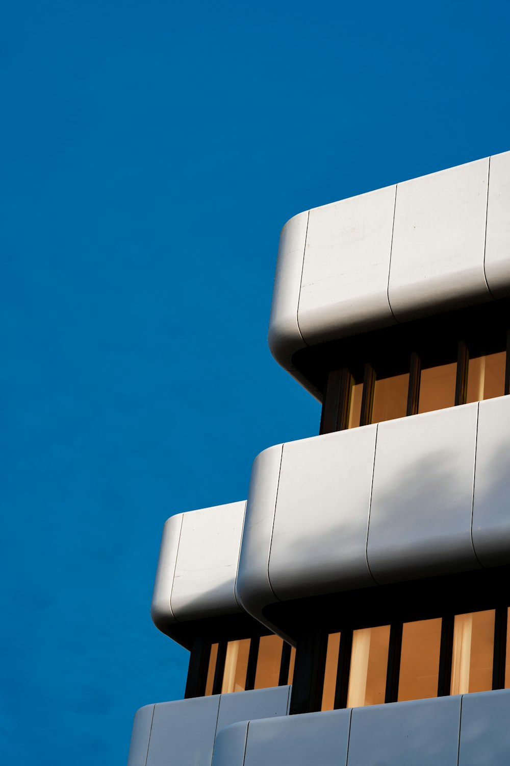 a close up of a building with a blue sky in the background