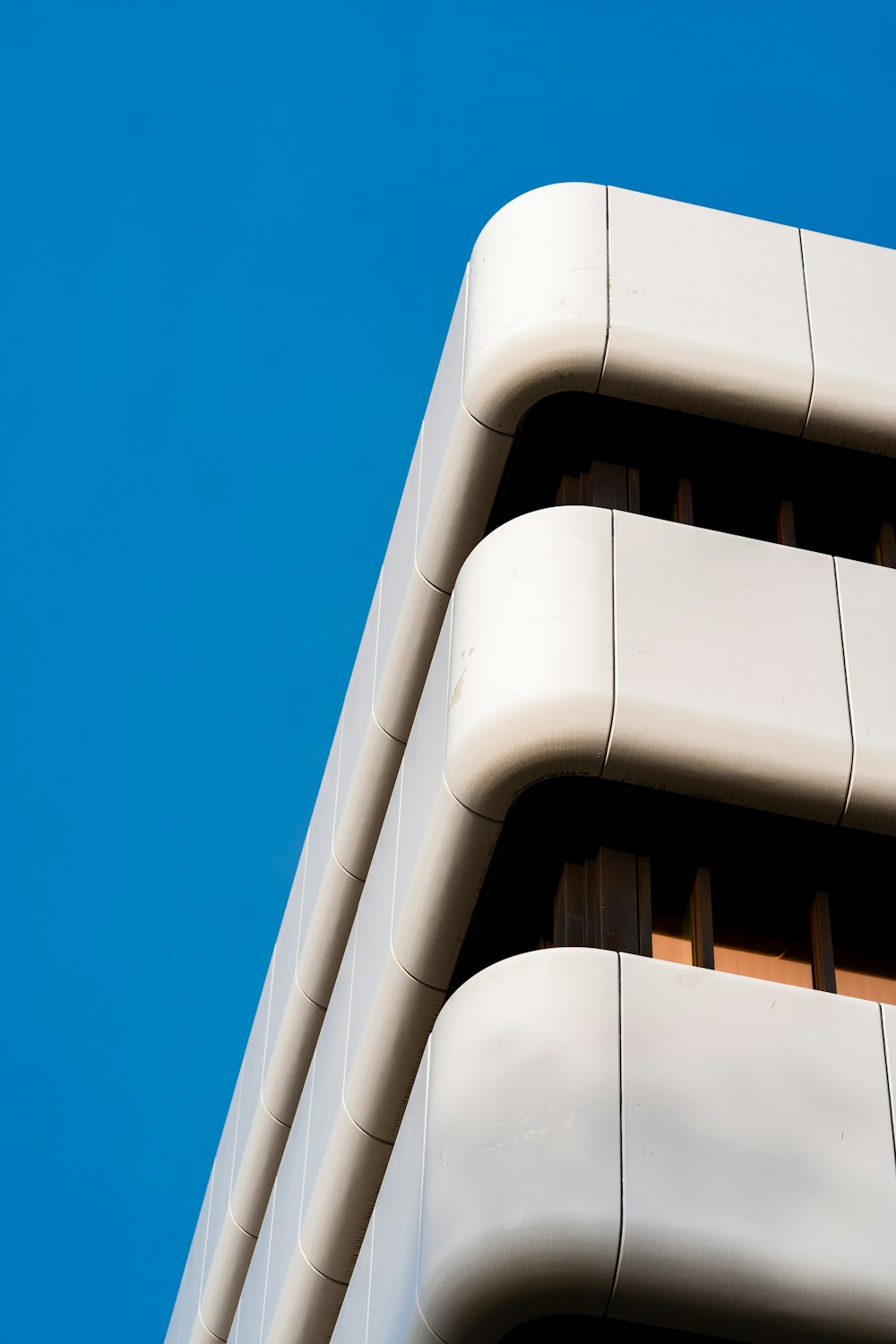 a close up of a building with a blue sky in the background