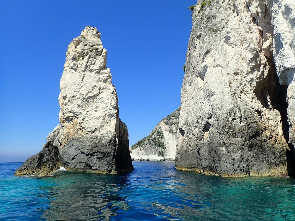 two large rocks sticking out of the water