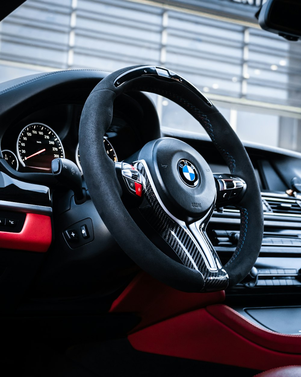 the interior of a car with a steering wheel and dashboard